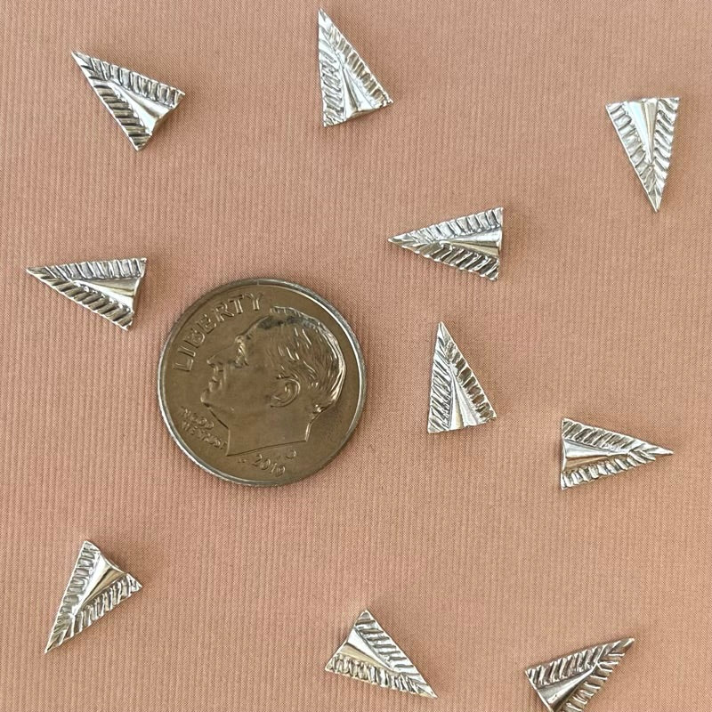 silver ruffled triangle casting