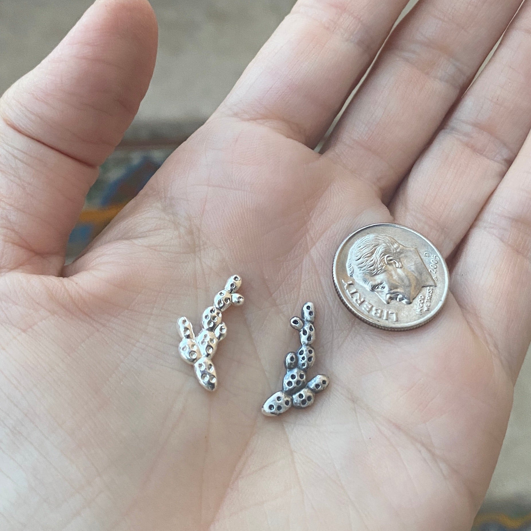silver prickly pear casting with dime for size reference