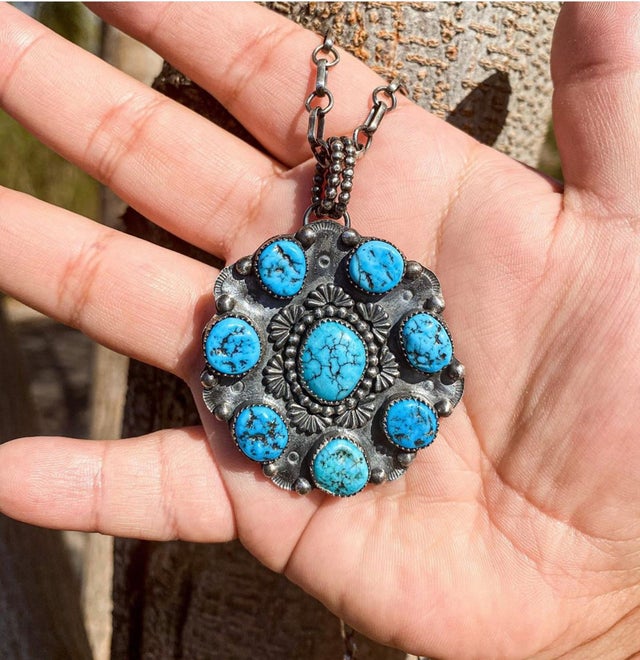 turquoise pendant made  with accent  setting sun castings